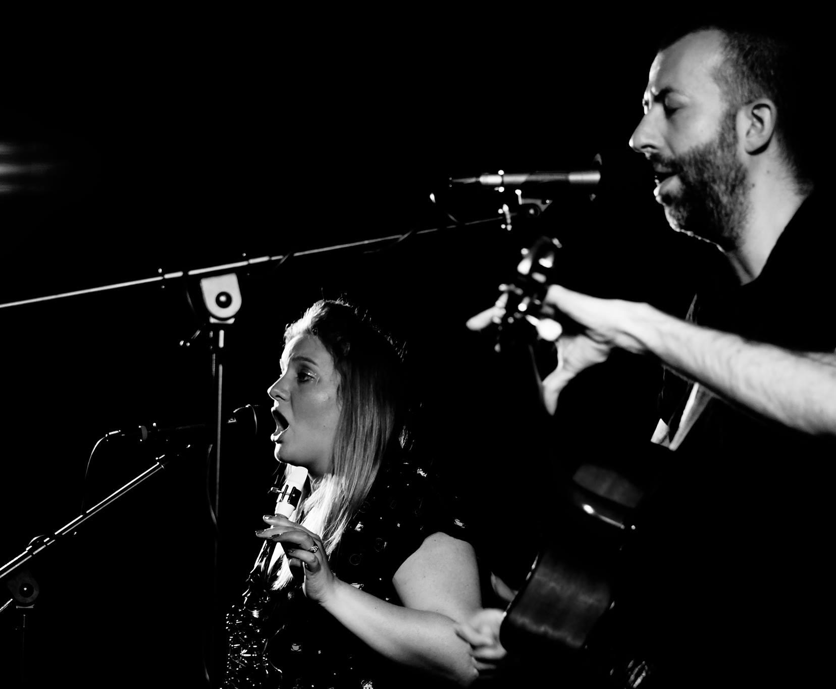 Natasha Koczy on stage with Jon Gomm. She is a session singer, sax player and clarinetist, and a music tutor in Saltaire, near Leeds in Yorkshire